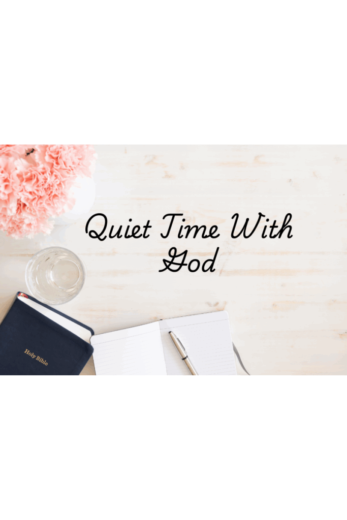 Flat lay with open Bible, prayer journal, and flowers for quiet time with God"